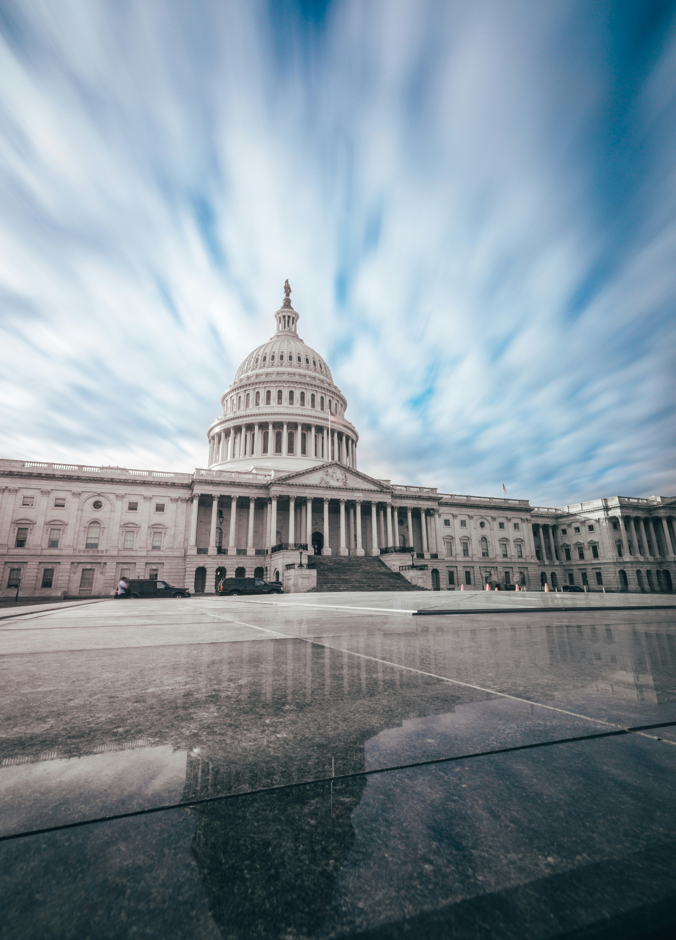 U.S. Capitol dome at golden hour with American flag